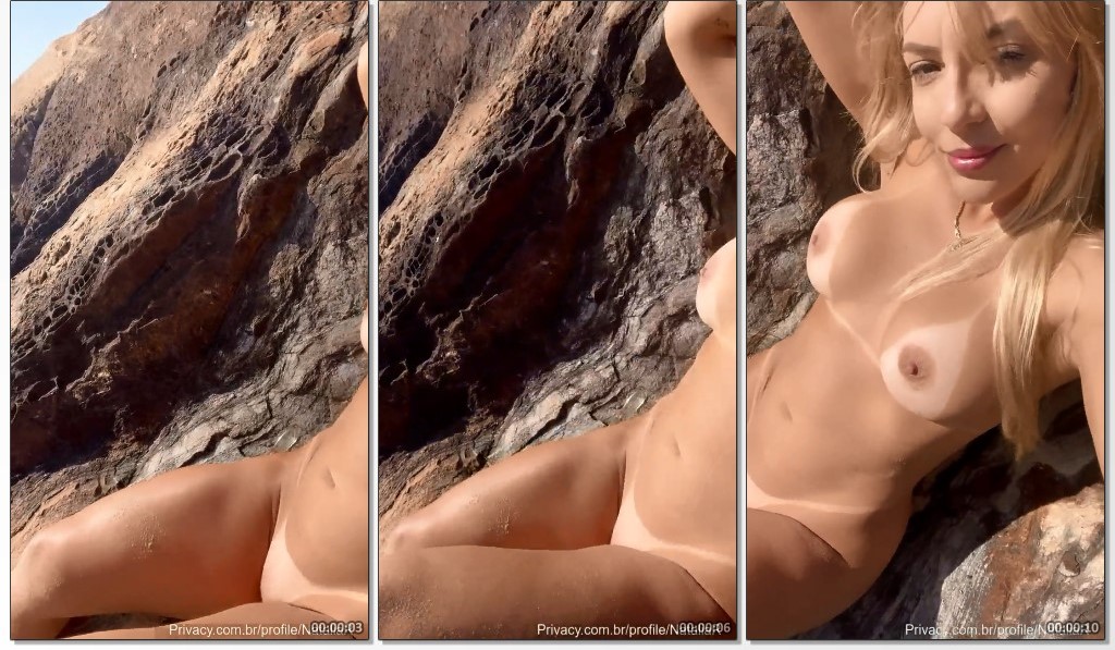 A loira linda Natalia R se despe na praia de nudismo